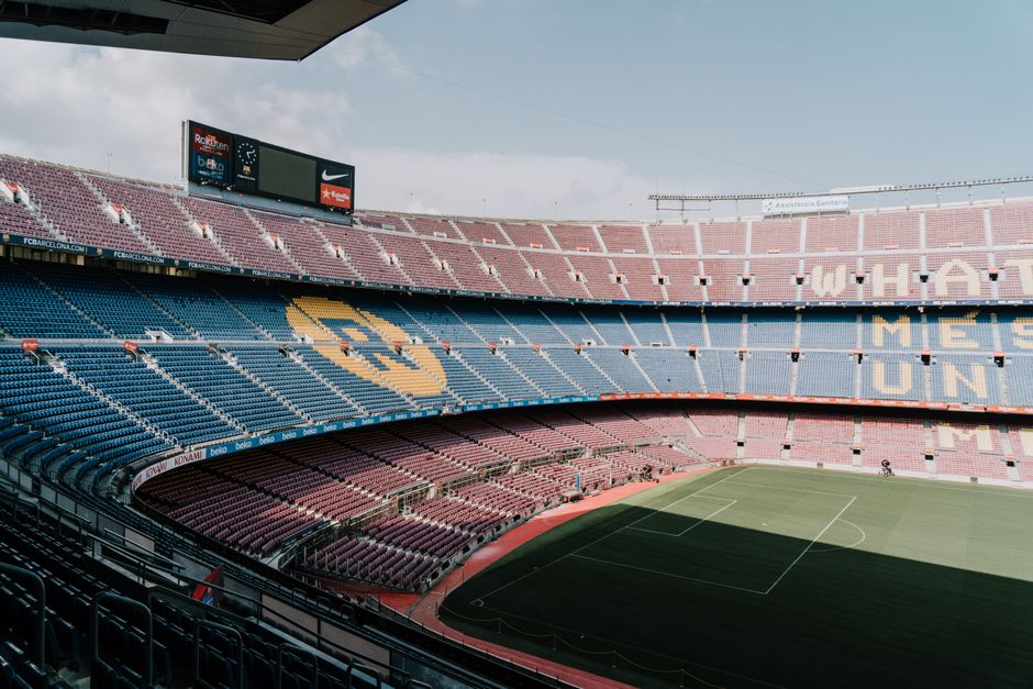 View of Camp Nou stadium in Barcelona, showcasing the iconic stands and field.